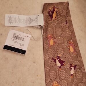 Brown Tie with Penguin Design
